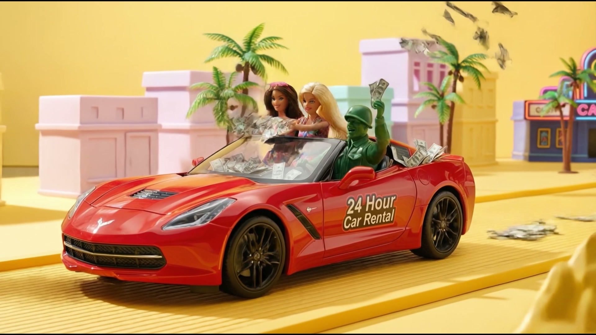 Toy soldier driving a red convertible marked 24 Hour Car Rental